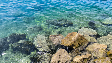 Adriatic sea surface with pebbles and stones 