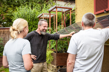 an electrician and specialist explains a newly installed pv system