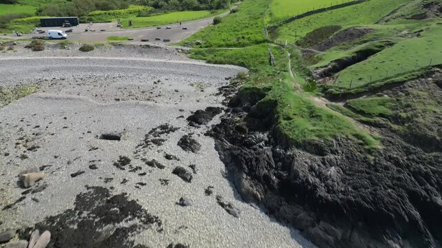 Aerial video over the coastline in Trefor Bay United Kingdom