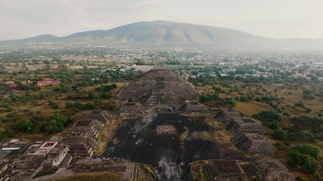 Backward aerial overlooking Pyramid of the Moon, Moon Plaza and the Jaguar Temple, Teotihuacan, Mexico