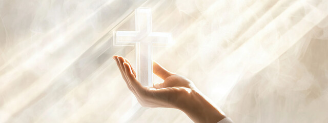 Hand gently holding a glowing cross with light rays shining in the background. Concepts of faith, spirituality, and divine presence.
