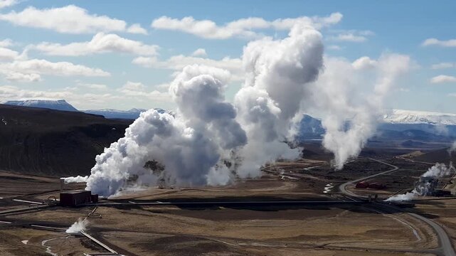 Geothermal facilities at Hverir Myvatn in Iceland emit large plumes of steam, highlighting the region's active volcanic and geothermal landscape, Iceland