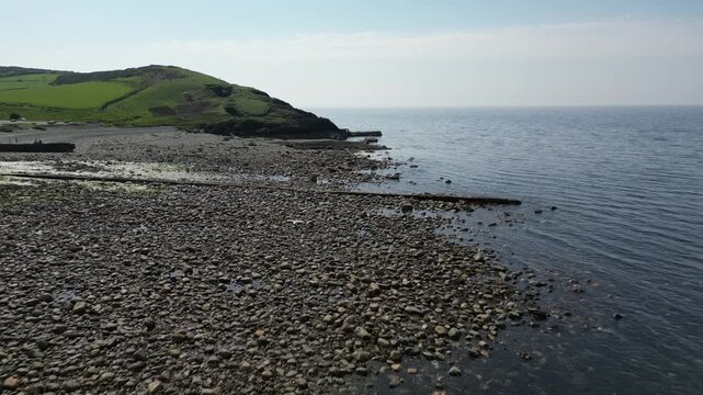 Aerial video over the coastline in Trefor Bay United Kingdom