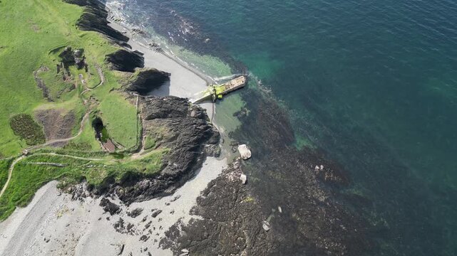 Aerial video over the coastline in Trefor Bay United Kingdom