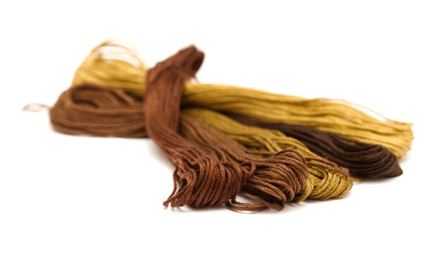 Cotton embroidery thread hanks in different colors, isolated on white background
