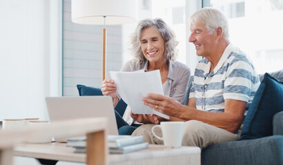 Paperwork, old couple and reading for retirement, house and financial report of senior people and planning. Happy, laptop and investment of fund, online and documents for pension in lounge of home