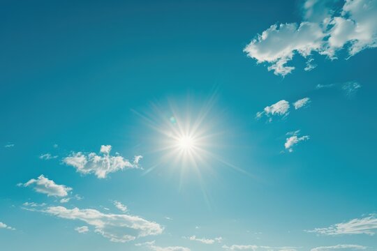 A clear blue sky with a bright shining sun, perfect for a sunny day