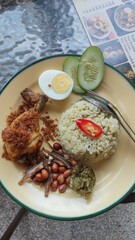 A close-up photo of a plate of nasi lemak.