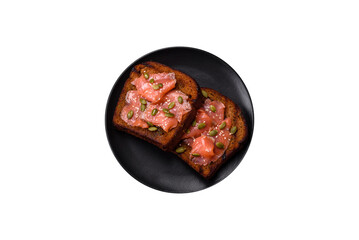Sandwich or bruschetta with toast, salmon, cream cheese