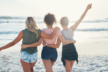 Back, hug and friends on beach for support, embrace and bonding together on vacation in California. Sand, freedom and group of women for travel, adventure and peace with fun for holiday in ocean