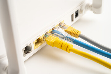 Ethernet cable with wireless router connect to internet service provider internet network.