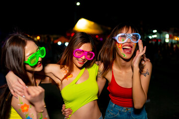 Group of Happy Asian woman friends enjoy and fun outdoor active lifestyle celebrating and dancing...