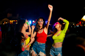 Group of Happy Asian woman friends enjoy and fun outdoor active lifestyle celebrating and dancing...
