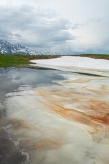 Reflections in a glacial lake. Reflection of the lake on the mountain. Beautiful mountain landscapes in Mestia Georgia. in the Caucasus  
Reflection of Koruldi lake and Caucasus mountains. Georgia.