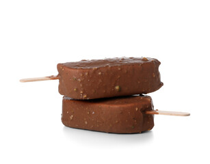 Delicious chocolate covered ice cream on stick against white background