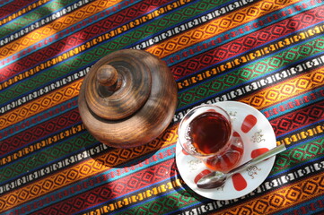Traditional Turkish black tea in a tulip shaped glass on a table in T&uuml;rkiye (Turkey)