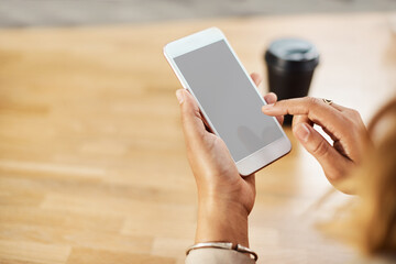Cellphone, screen and hands of person on table, scroll and chat with online contact by above. Office, employee and connection with mobile app for business info, networking and text message to client