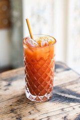 A delicious bloody mary on a sunny terrace table in summer