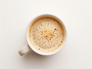 Obraz premium Cup of Frothy Coffee on White Background Top View