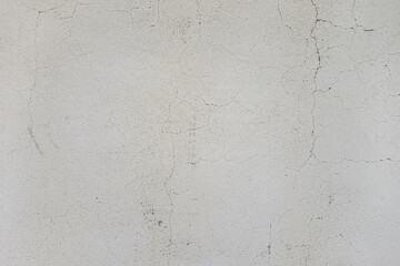 abstract background of an old shabby painted white wall close up
