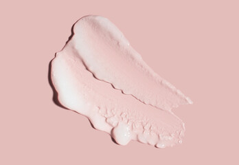 Face or body white cream hair balm, peeling peach cream light pink coral background