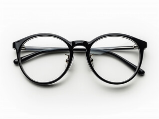 Stylish Black Round Glasses Placed on a Clean White Surface in Bright Light