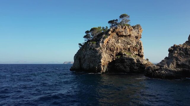 Scenic drone footage of the massive rock formations near the shores of Mallorca