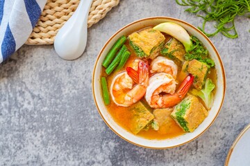 Shrimp Sour Soup with vegetable omelet , thai food, top view food table