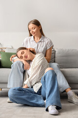 Obraz premium Young lesbian couple resting at home