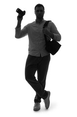 Fototapeta premium Silhouette of male photographer with camera on white background