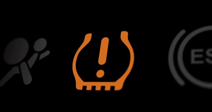 Low tire pressure warning light on car dashboard, empty tyre blinking icon, footage