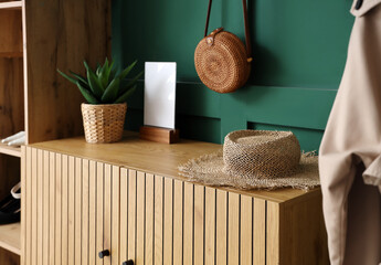 Straw hat on commode in hall, closeup