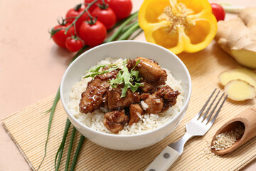 Tasty sweet and sour chicken with rice in bowl, vegetables and fork on beige background, closeup