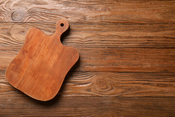 Wooden cutting board on table