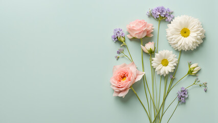 A bouquet of flowers is arranged on a green background