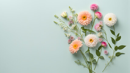 A bouquet of flowers is arranged on a green background