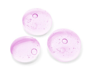 Drops of violet cosmetic oil on white background