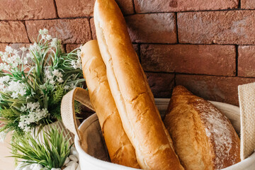 Aromatic baked goods in a basket on the kitchen counter. Perfect for creating a cozy atmosphere and inspiring your home baking. Add taste and style to your kitchen decor