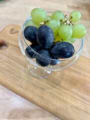 delicious green and red grapes served in glass bowls