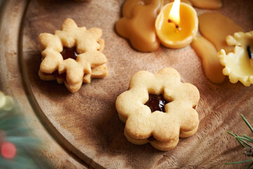 Homemade Linzer Christmas cookies filled with marmalade
