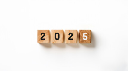 Wooden blocks display year 2025 on a white background, symbol the future, new beginnings and upcoming.