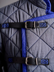 Historical fashion. Medieval knight cloth. Padded jacket gambeson.