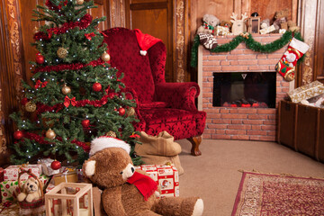 A traditional and cozy Christmas setting in an ornately decorated room with a festive tree and fireplace awaiting the holiday celebrations.