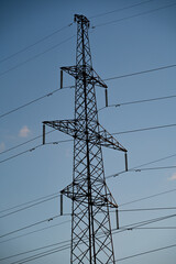 Power lines with wires on blue sky