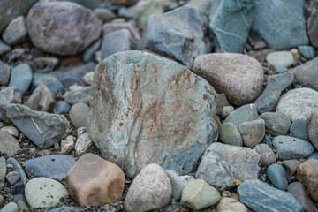 Large stones lie on the shore