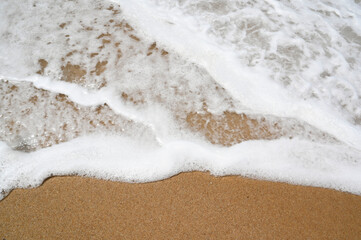 Summer surf waves surge on the beach at atlantic sea. Coast with splash water seaside.