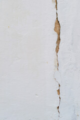 Crack on white plastered wall