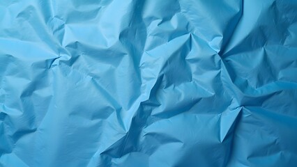 Obraz premium blue crumpled and creased paper poster texture isolated on white background 