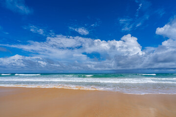 Empty tropical beach and seascape, Beautiful sandy beach and sea in sunny day,Blue sky in good weather day, Beach sea space area nature background