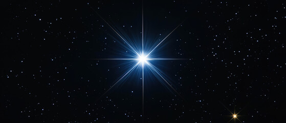 Obraz premium Bright star shining in a dark night sky filled with twinkling stars, creating a serene and celestial atmosphere.